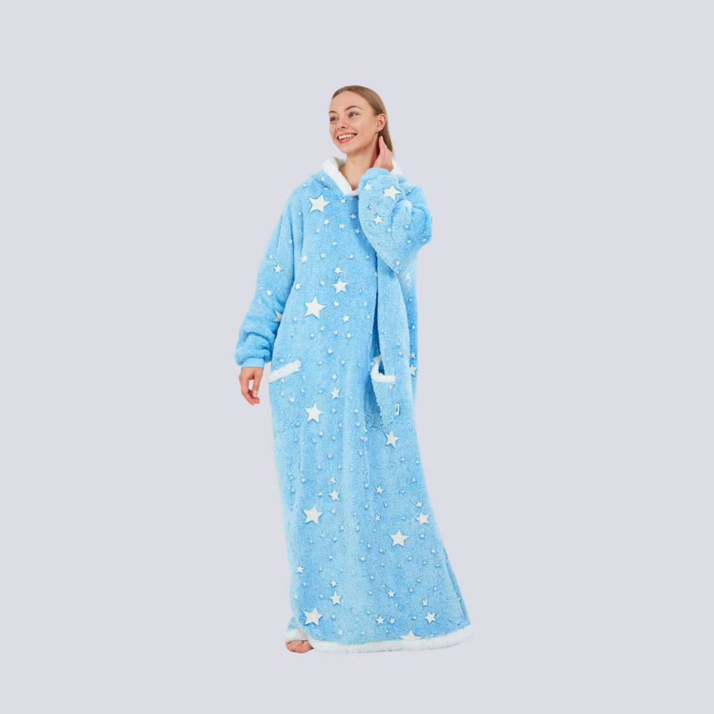 emale model wearing oversized baby blue hoodie blanket with sherpa hem and star print, front view
