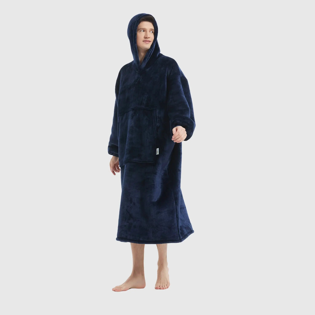 Male model wearing navy blue full-length hoodie blanket, front view